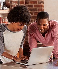 Couple working on laptop